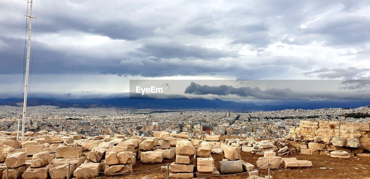 Panoramic view of building and landscape against sky