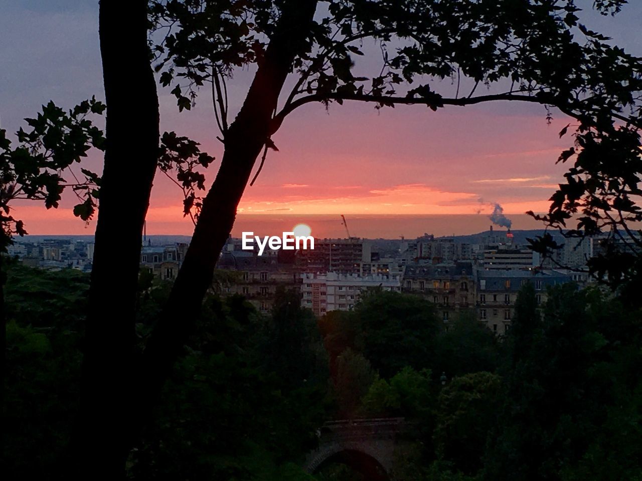 VIEW OF BUILDINGS AT SUNSET