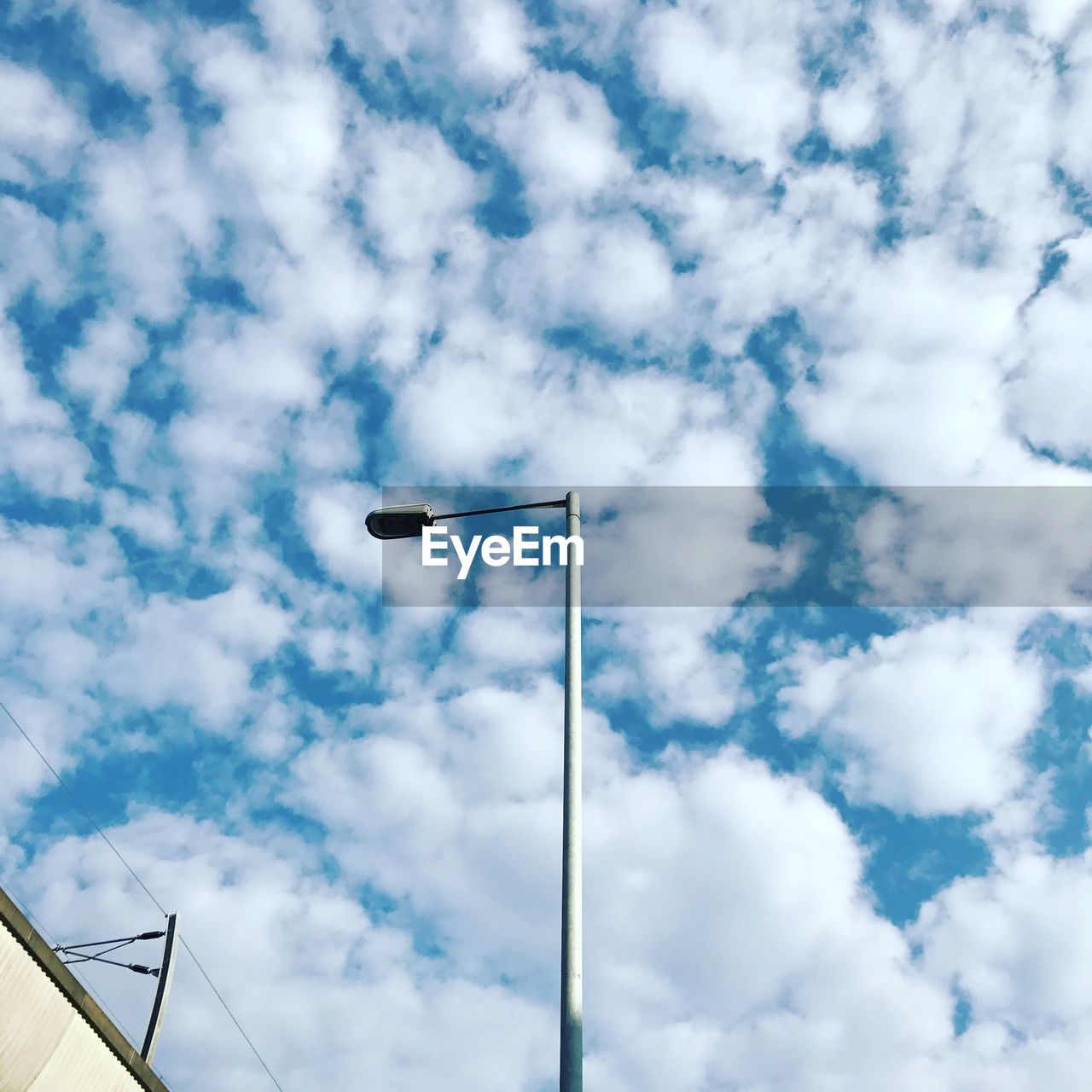 Low angle view of street light against sky