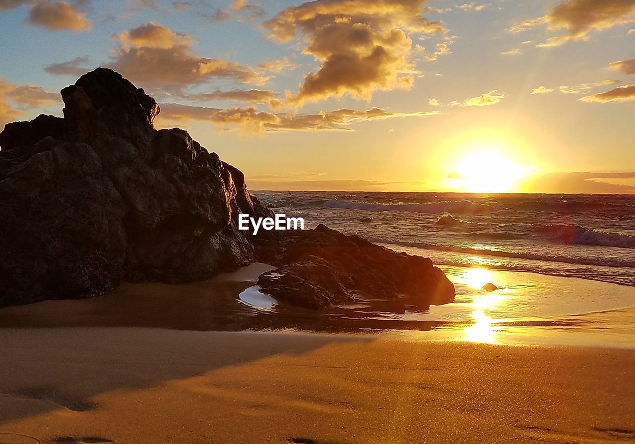 Scenic view of beach during sunset