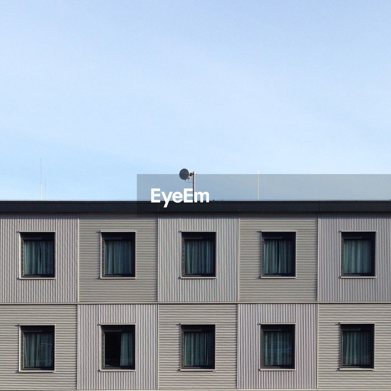 Low angle view of building against blue sky