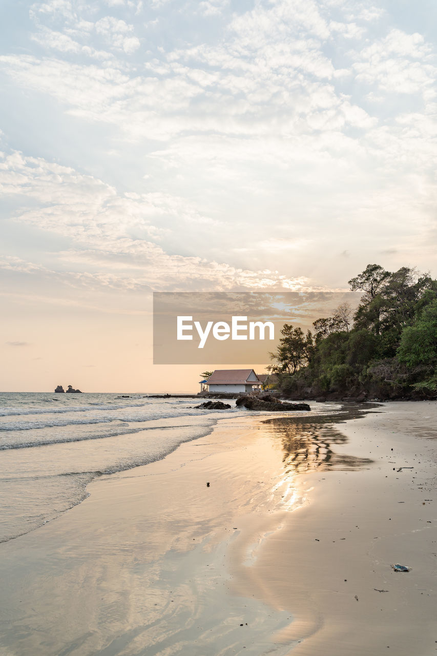 Scenic view of beach against sky during sunset