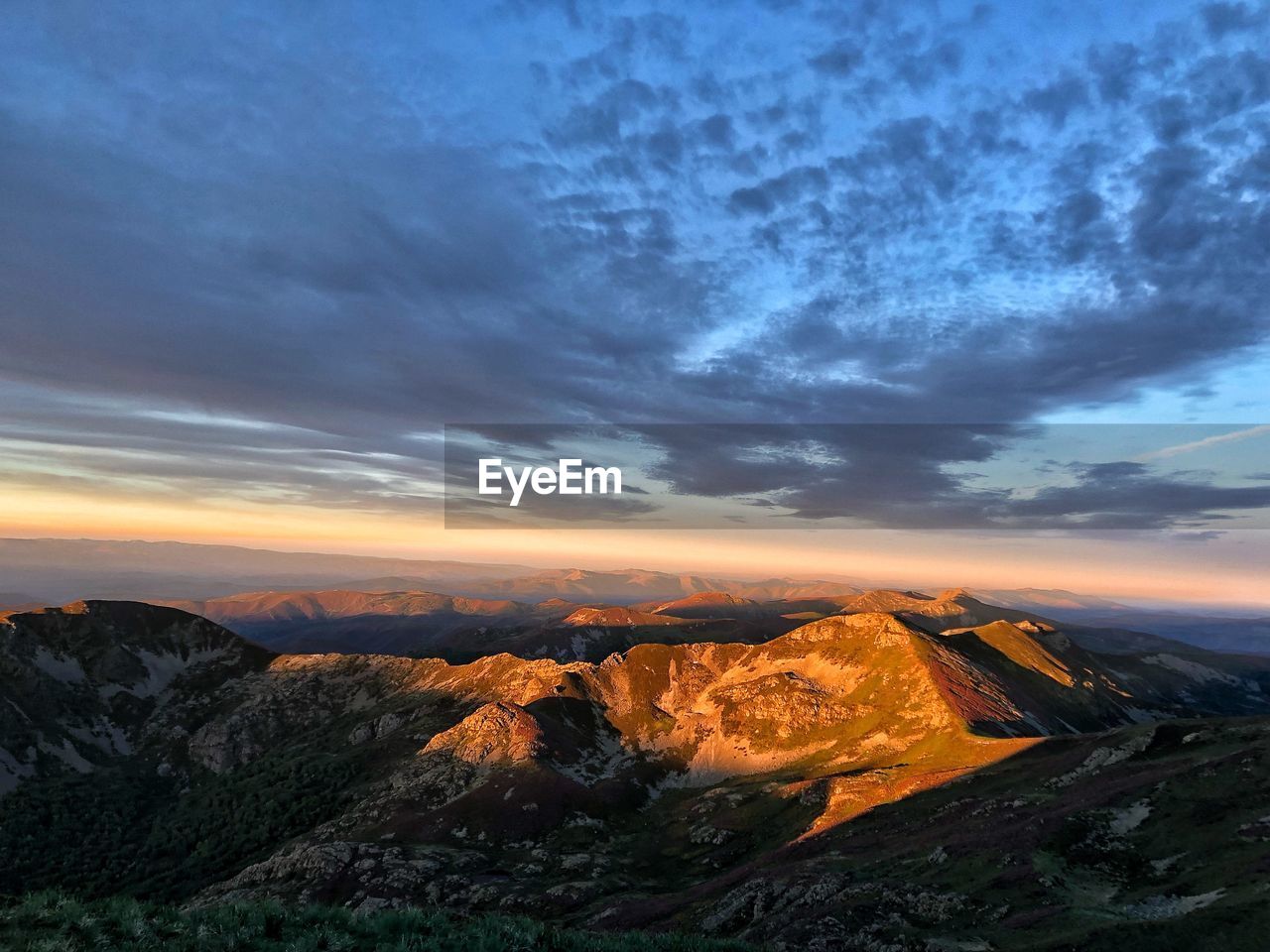 Aerial view of landscape against cloudy sky