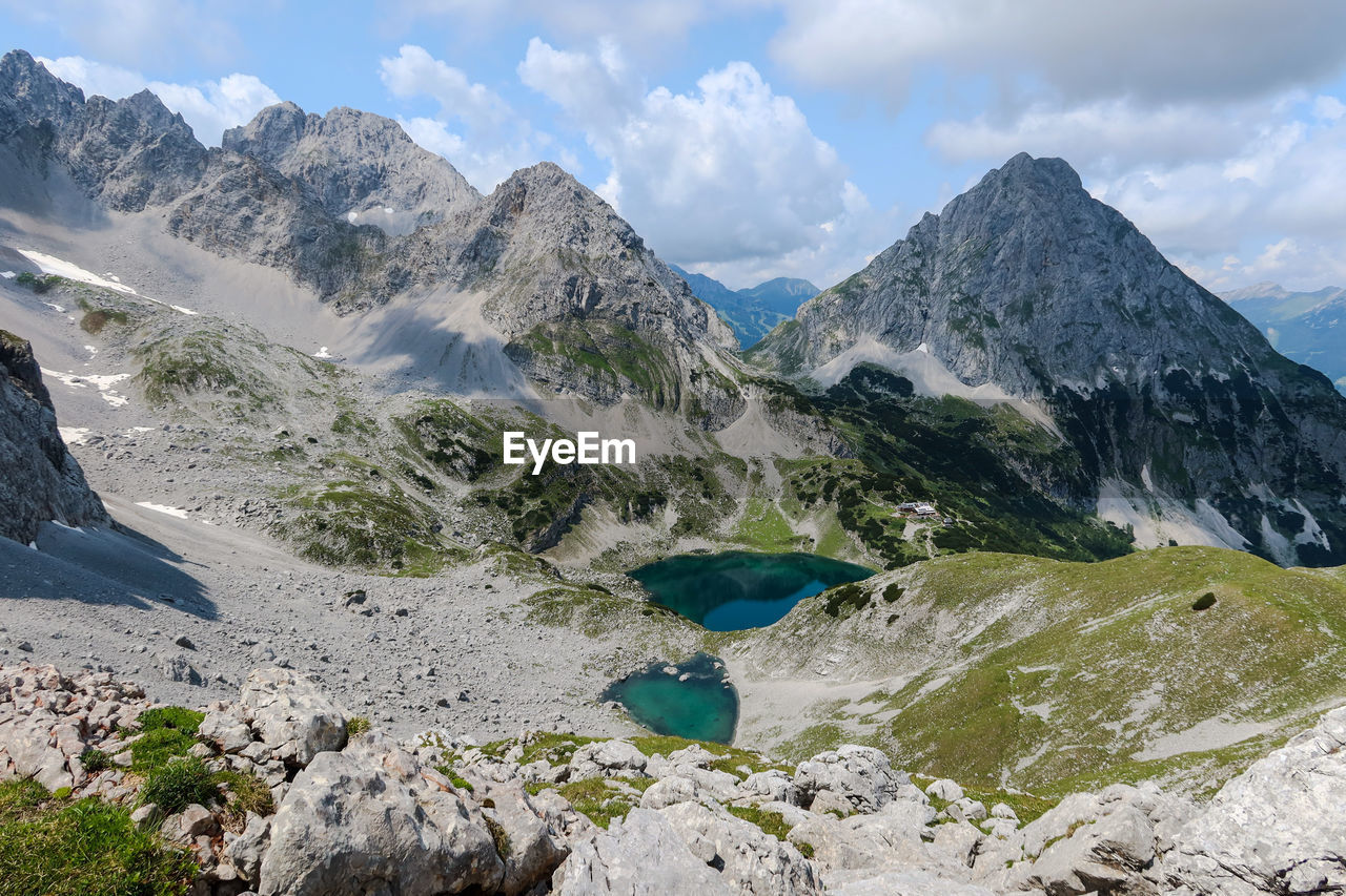 PANORAMIC SHOT OF SNOWCAPPED MOUNTAINS AGAINST SKY