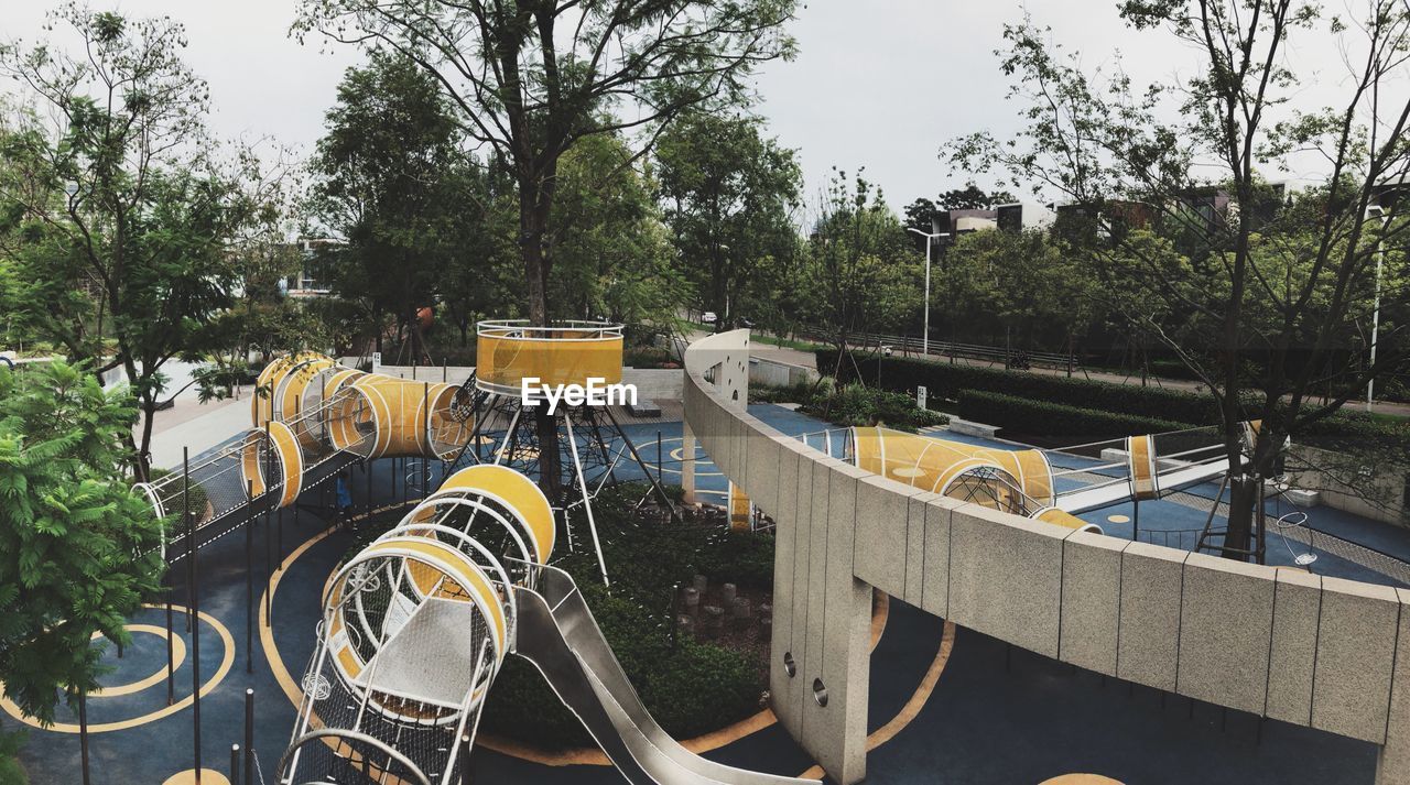 PANORAMIC VIEW OF PARK BY SWIMMING POOL IN PLAYGROUND