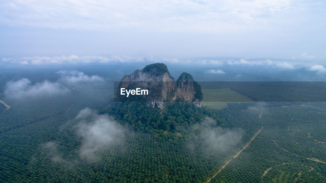 Aerial view of agricultural field against sky