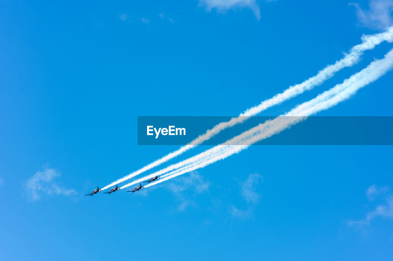 LOW ANGLE VIEW OF AIRPLANE AGAINST SKY