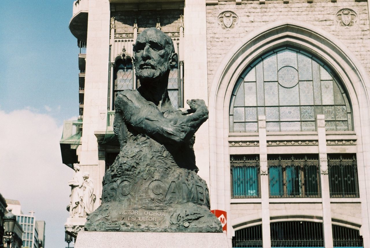 STATUE IN FRONT OF BUILDING