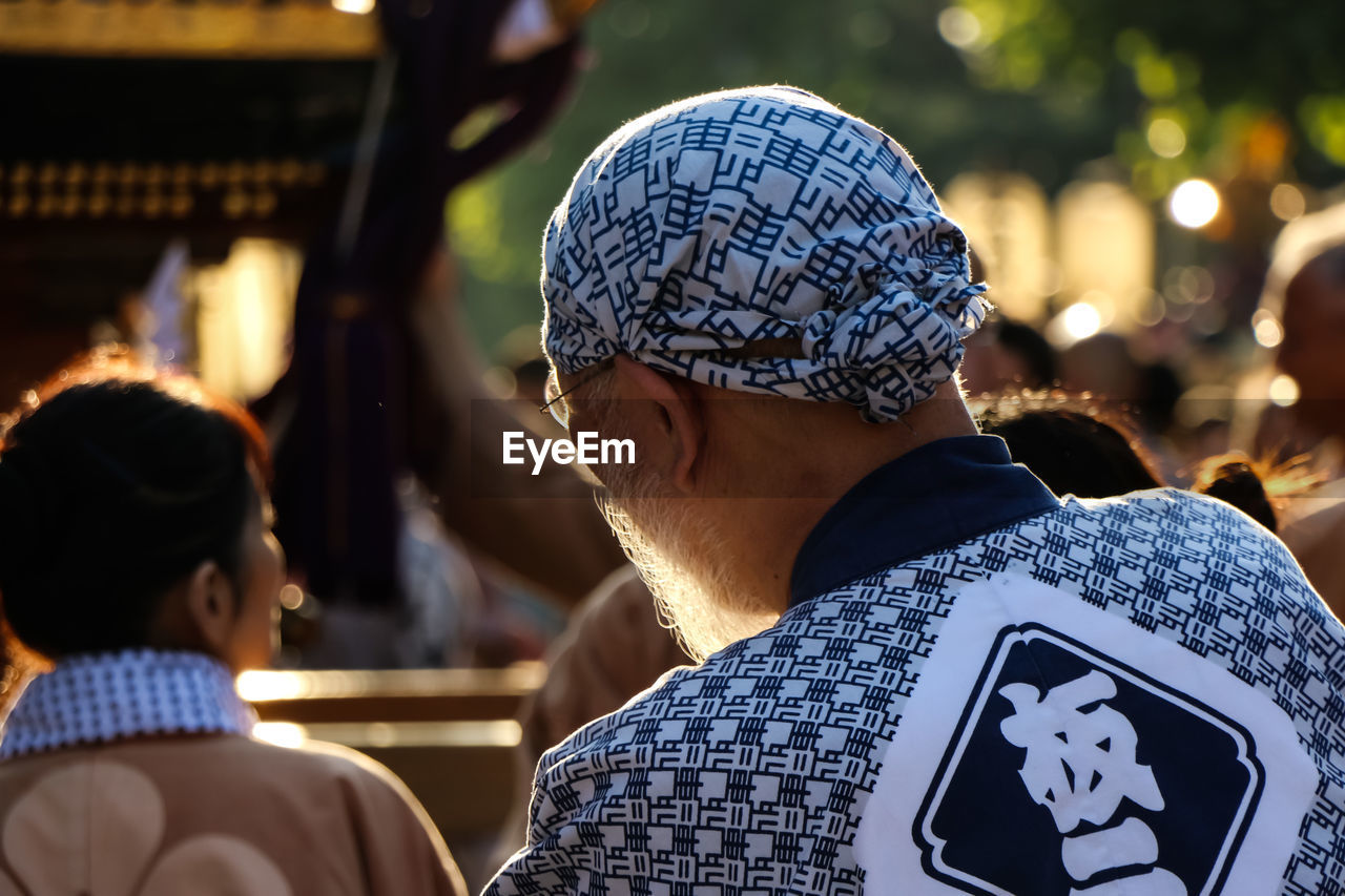 Rear view of man standing in japanese festival