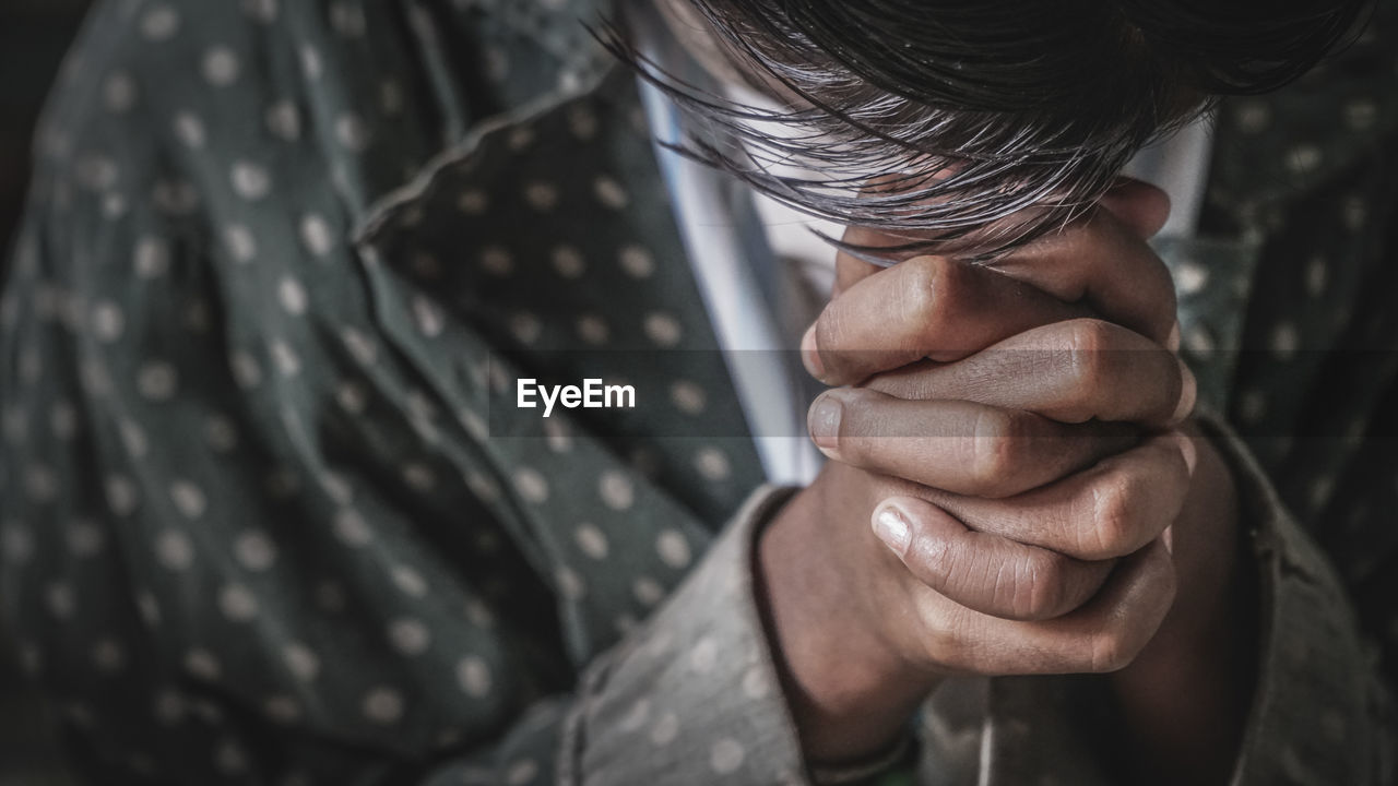 Close up of person praying