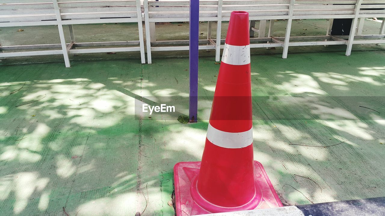 HIGH ANGLE VIEW OF RED RAILING IN WATER