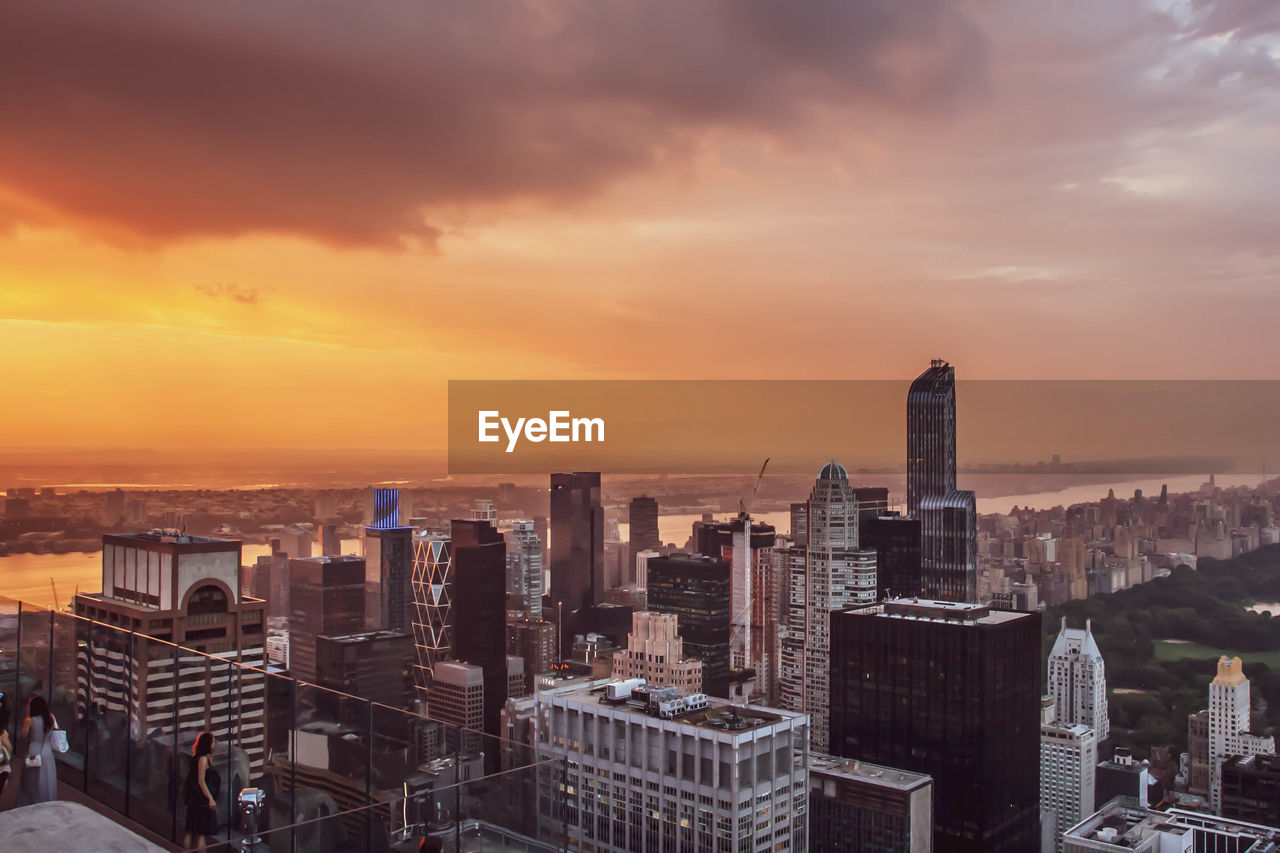 High angle view of buildings against sky during sunset