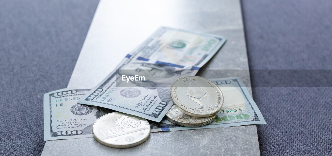 CLOSE-UP HIGH ANGLE VIEW OF COINS