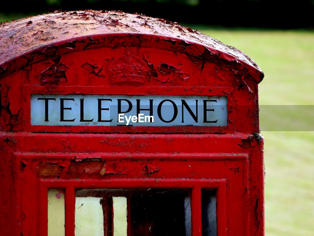 Close-up of abandoned telephone booth