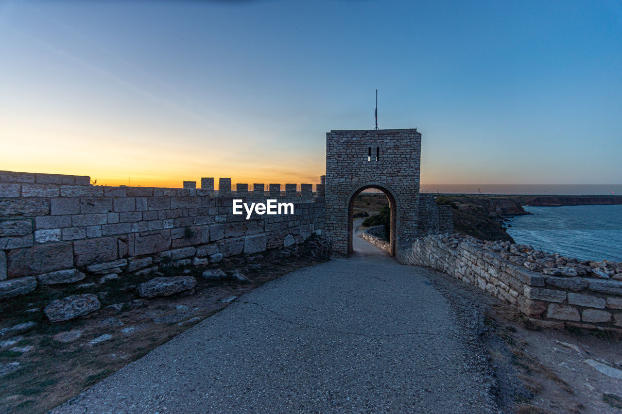 View of historical building against sky during sunset