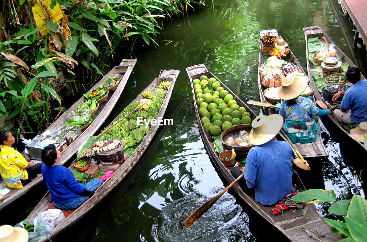 HIGH ANGLE VIEW OF PEOPLE IN BOAT