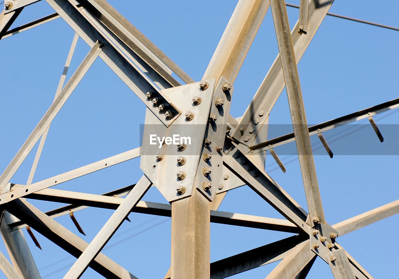 The bolts of a load-bearing structure of an electric steel pylon.