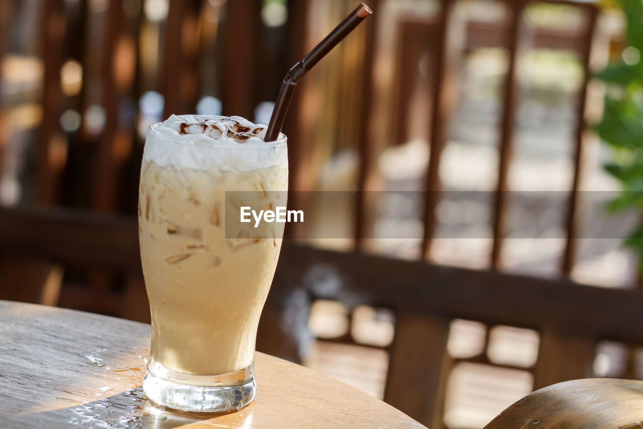 ICE CREAM WITH GLASS OF DRINK