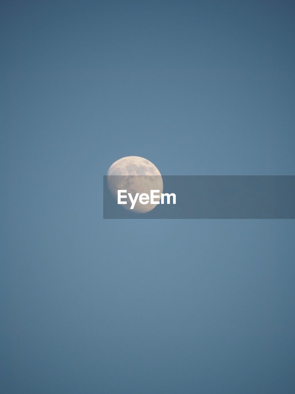 LOW ANGLE VIEW OF MOON IN SKY