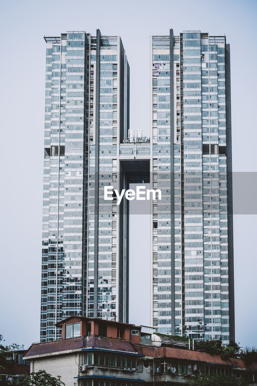 BUILDINGS AGAINST CLEAR SKY