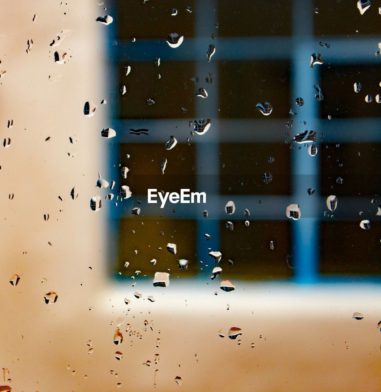 Full frame shot of glass window with rain drops