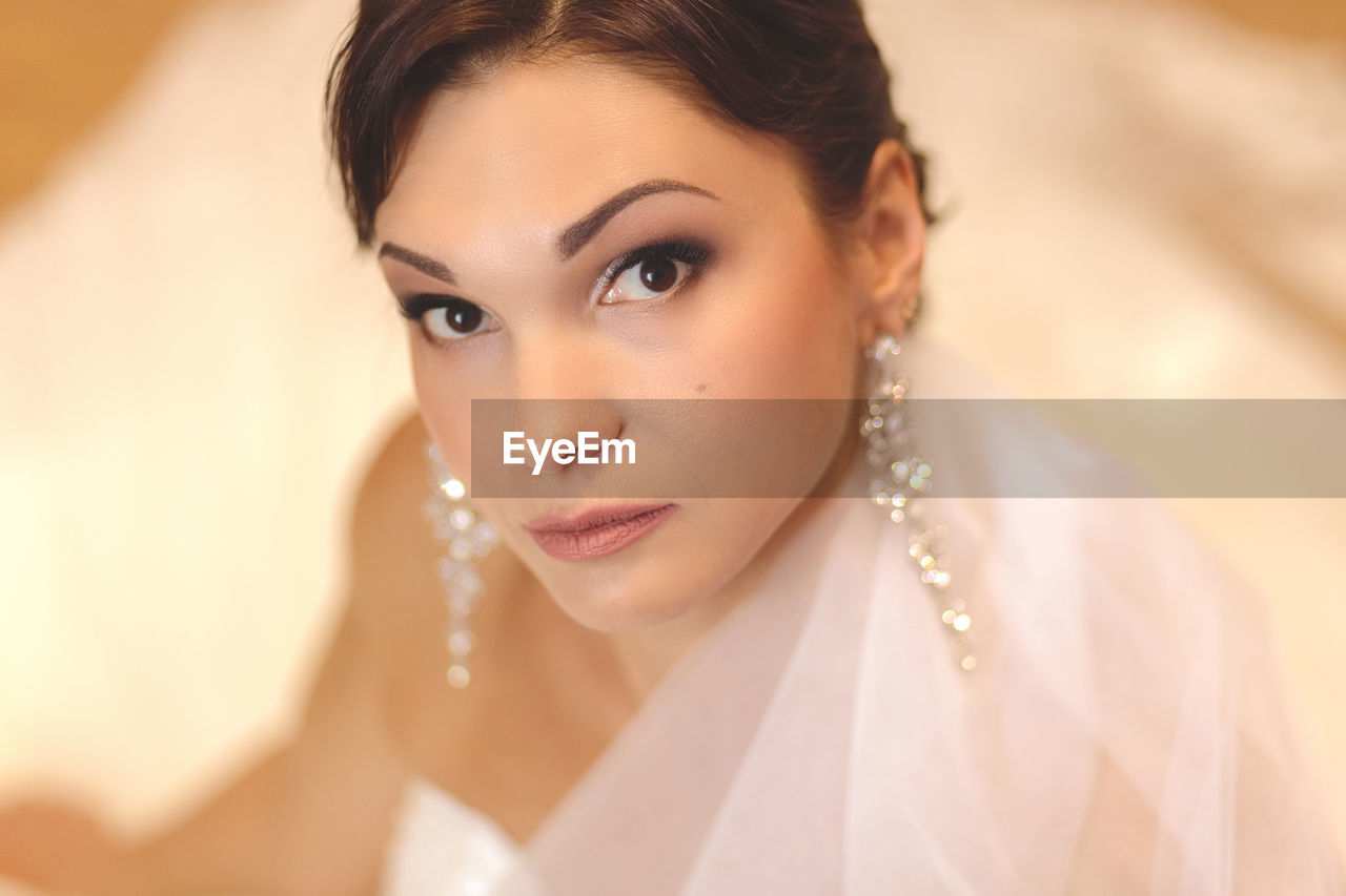 High angle portrait of bride wearing wedding dress