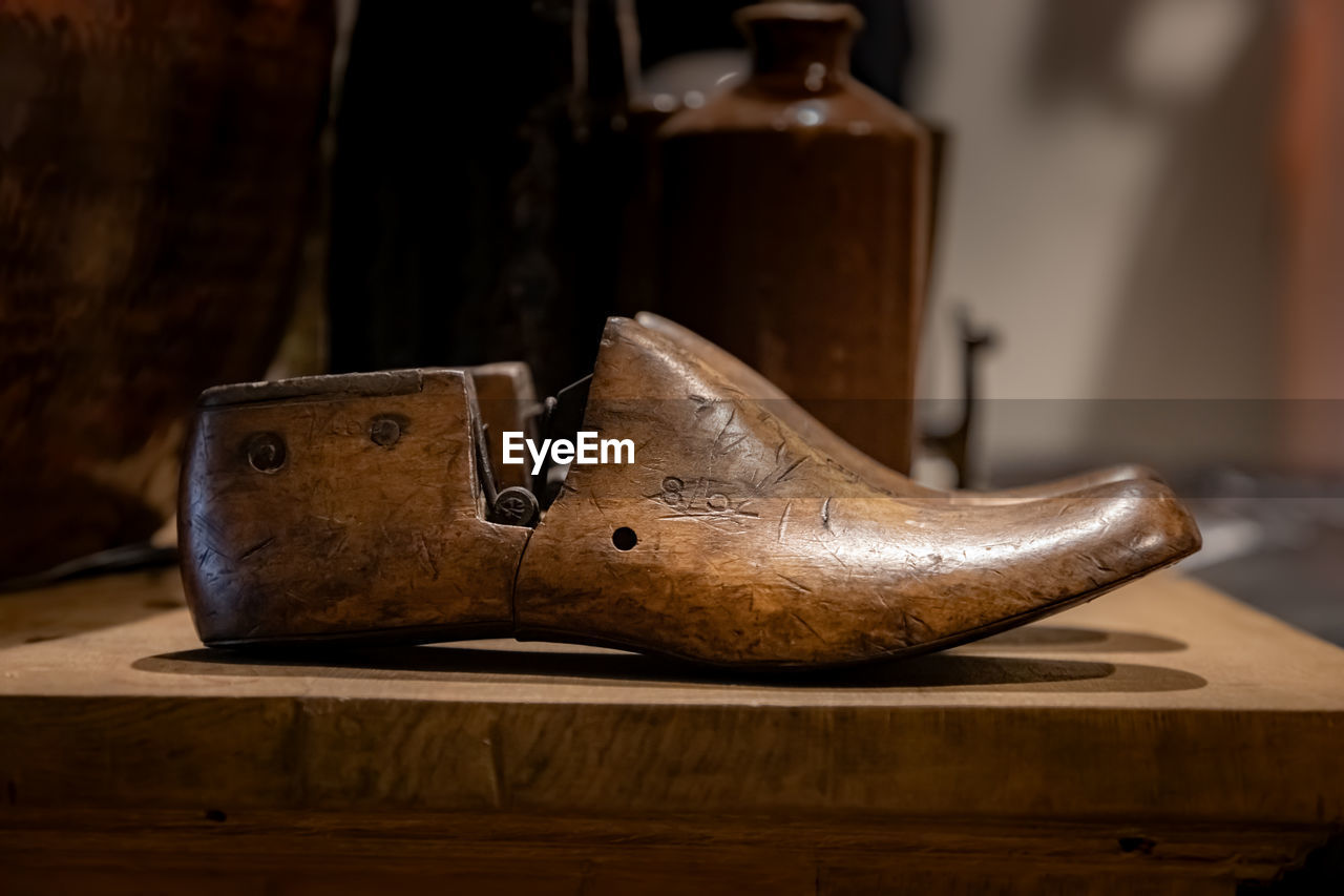 Close-up of wooden shoe on table