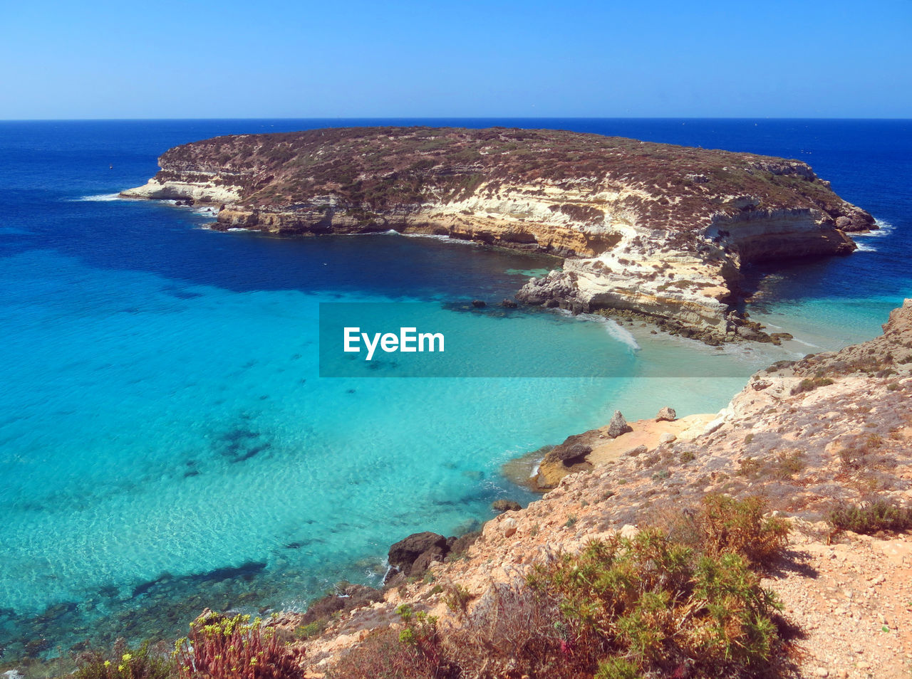 Small island near lampedusa in italy and blue medi