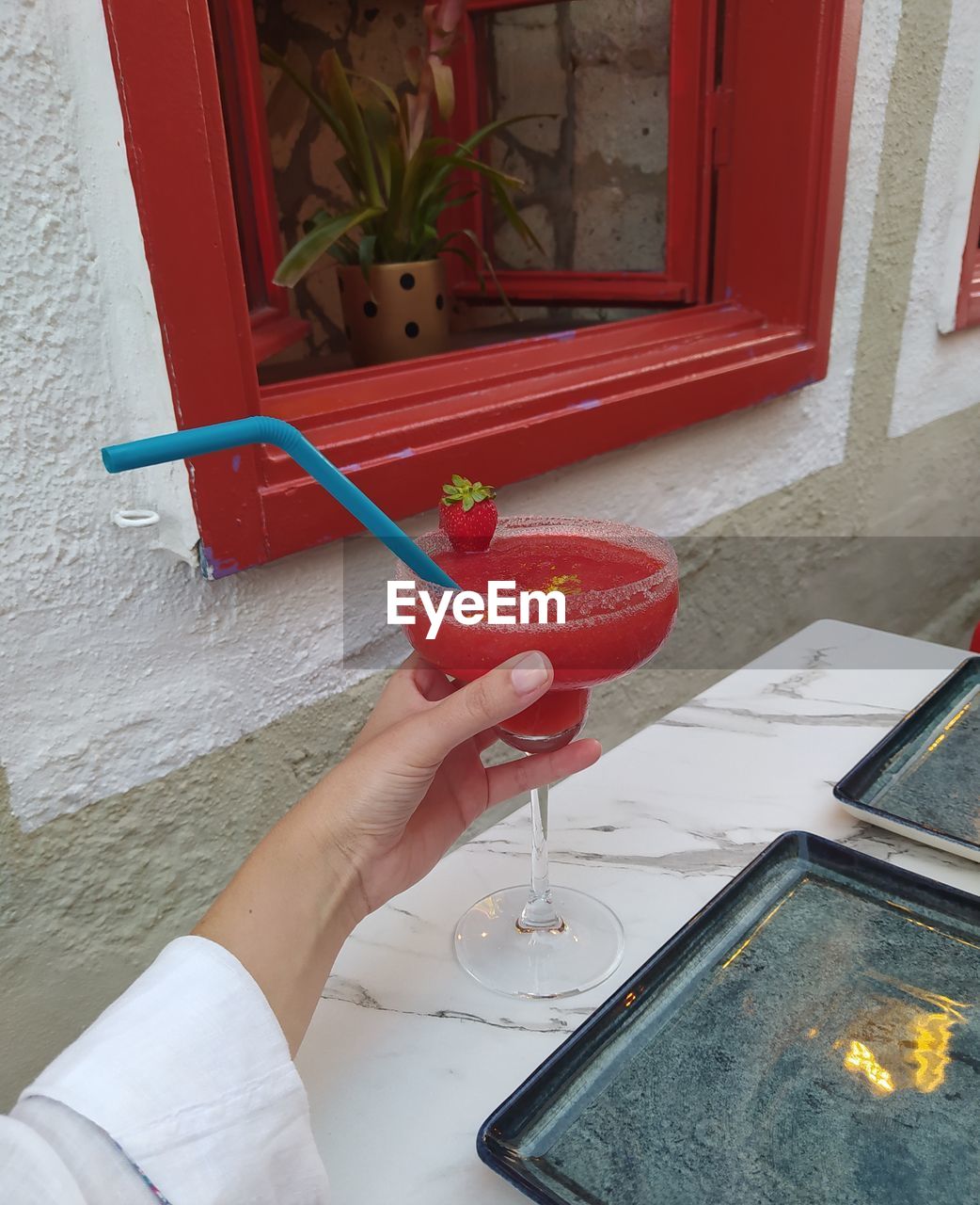 Cropped hand of person holding food