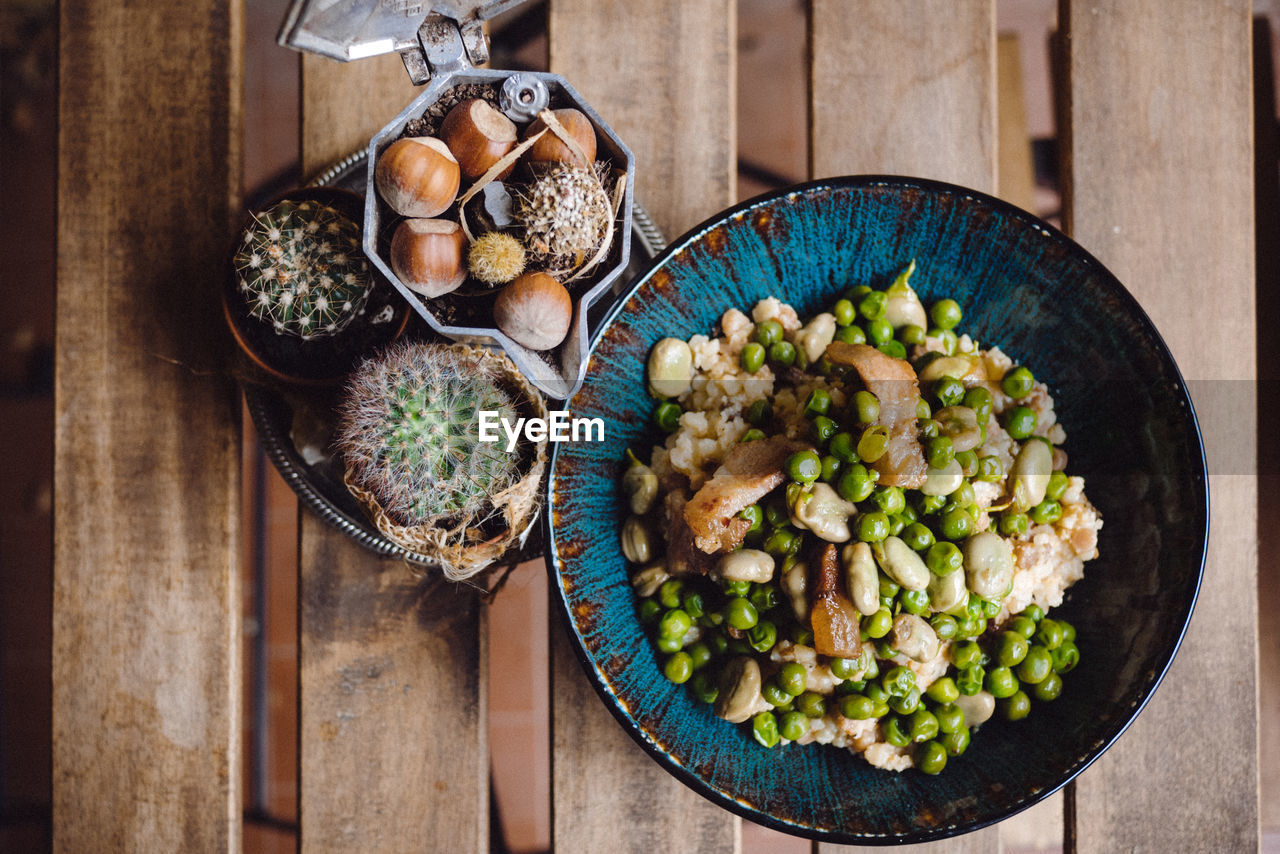 HIGH ANGLE VIEW OF VEGETABLES IN CONTAINER ON TABLE