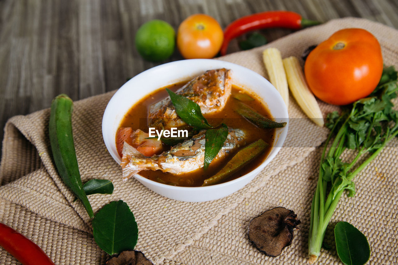High angle view of fish curry in bowl on table
