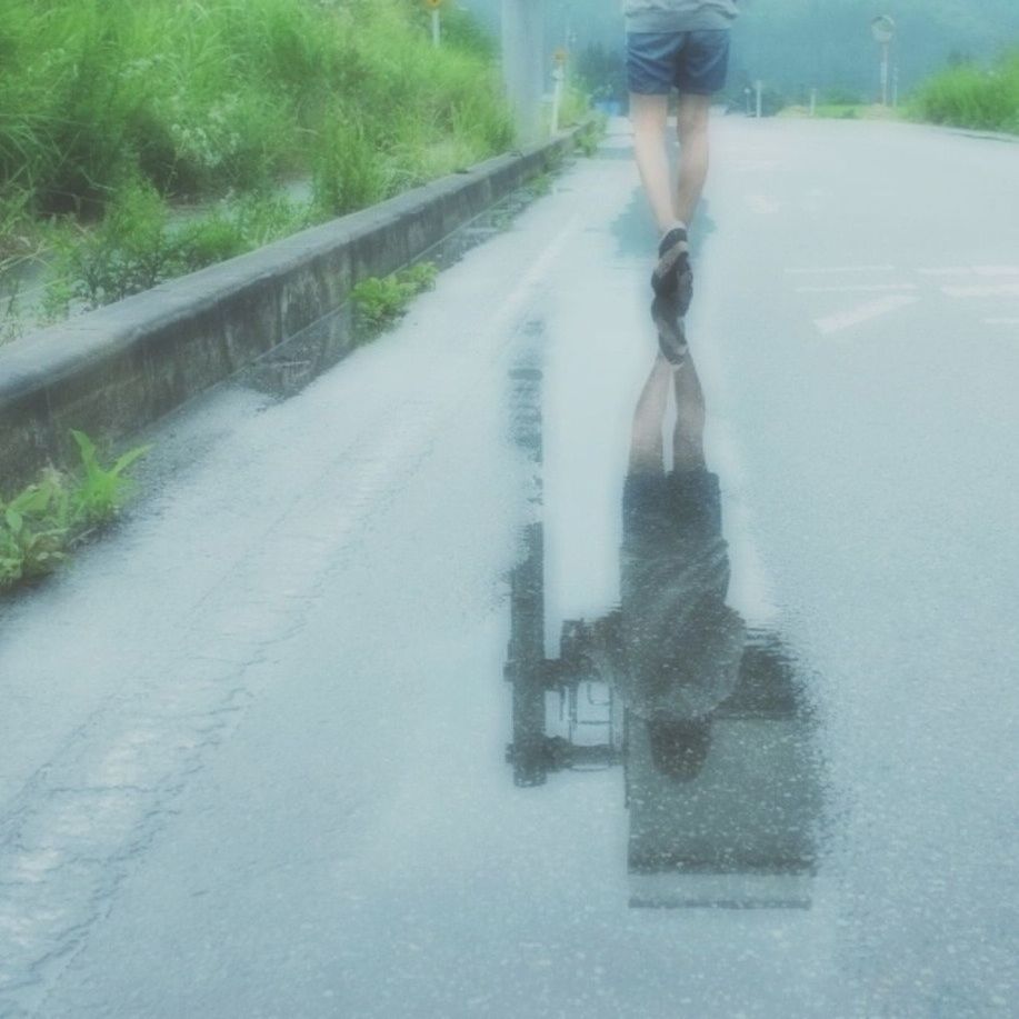 WOMAN WALKING ON ROAD