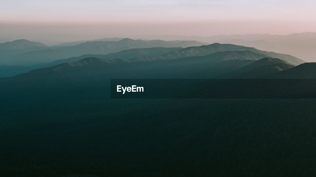 Scenic view of mountains against sky during sunset