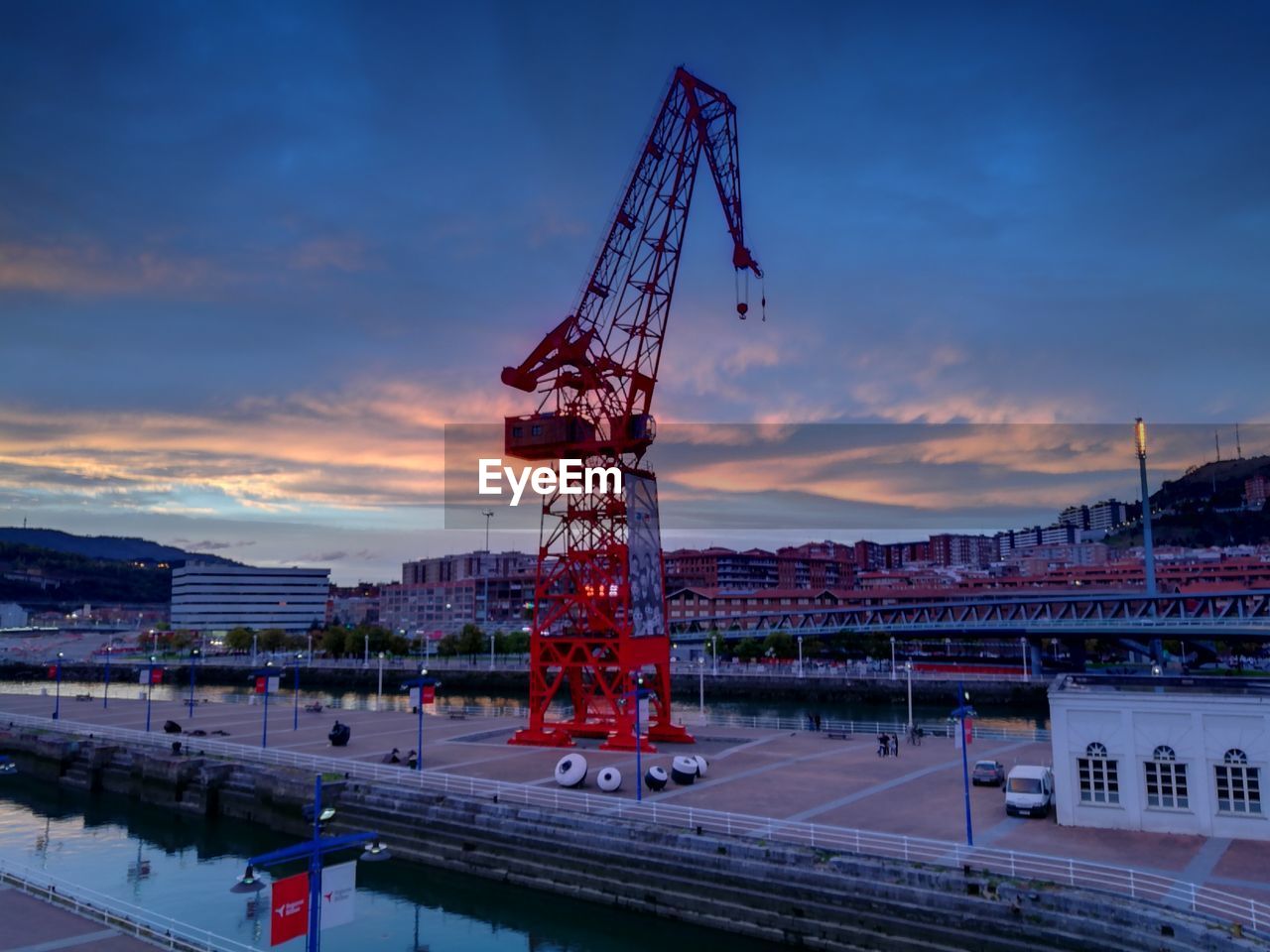 CONSTRUCTION SITE AGAINST SKY DURING SUNSET