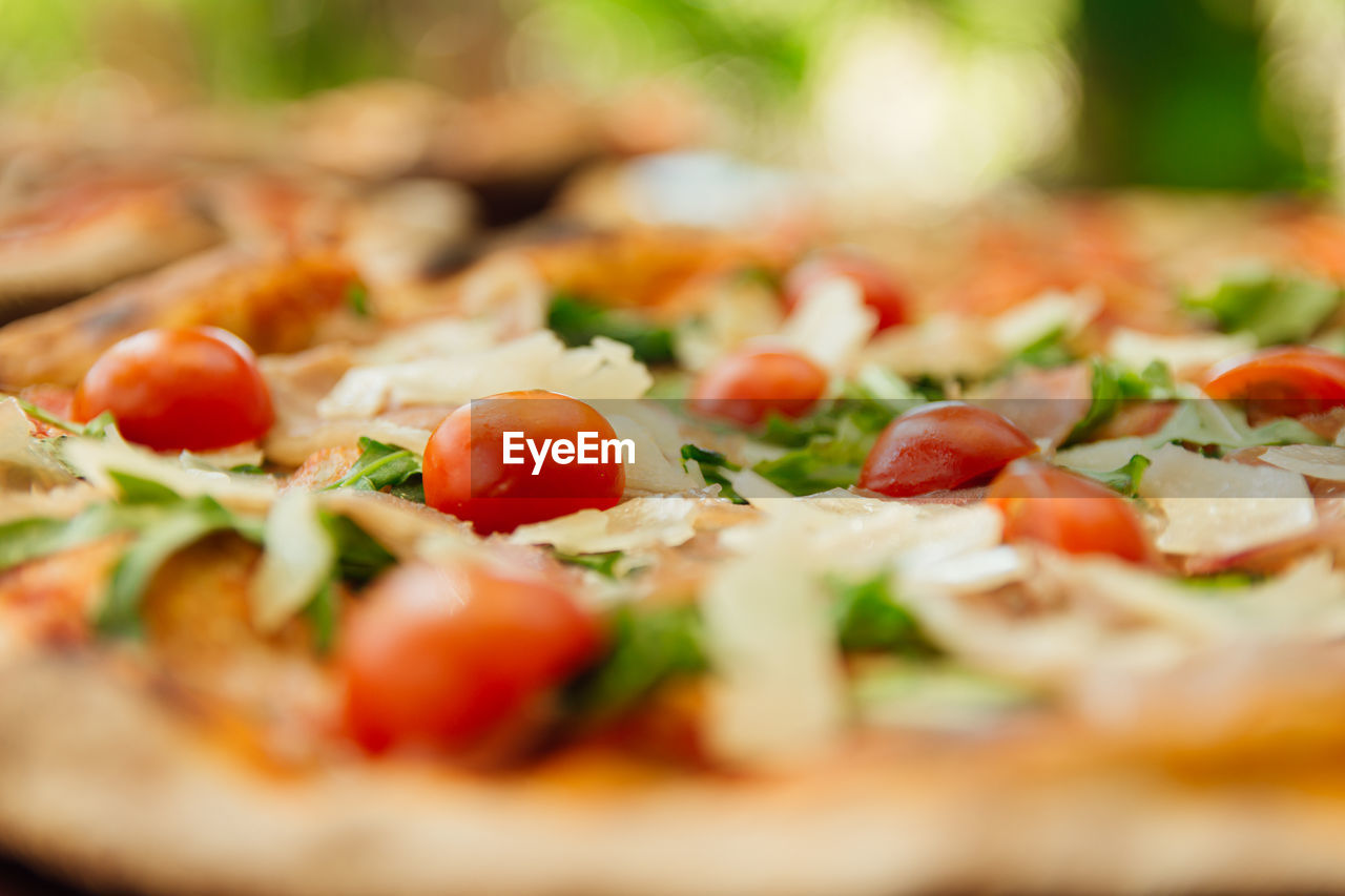 food and drink, food, vegetable, tomato, pizza, fruit, healthy eating, freshness, italian food, dish, herb, selective focus, cuisine, cheese, dairy, fast food, produce, no people, meal, close-up, baked, onion, wellbeing, plant, basil, mozzarella, copy space, vegetarian food, gourmet, savory food, restaurant