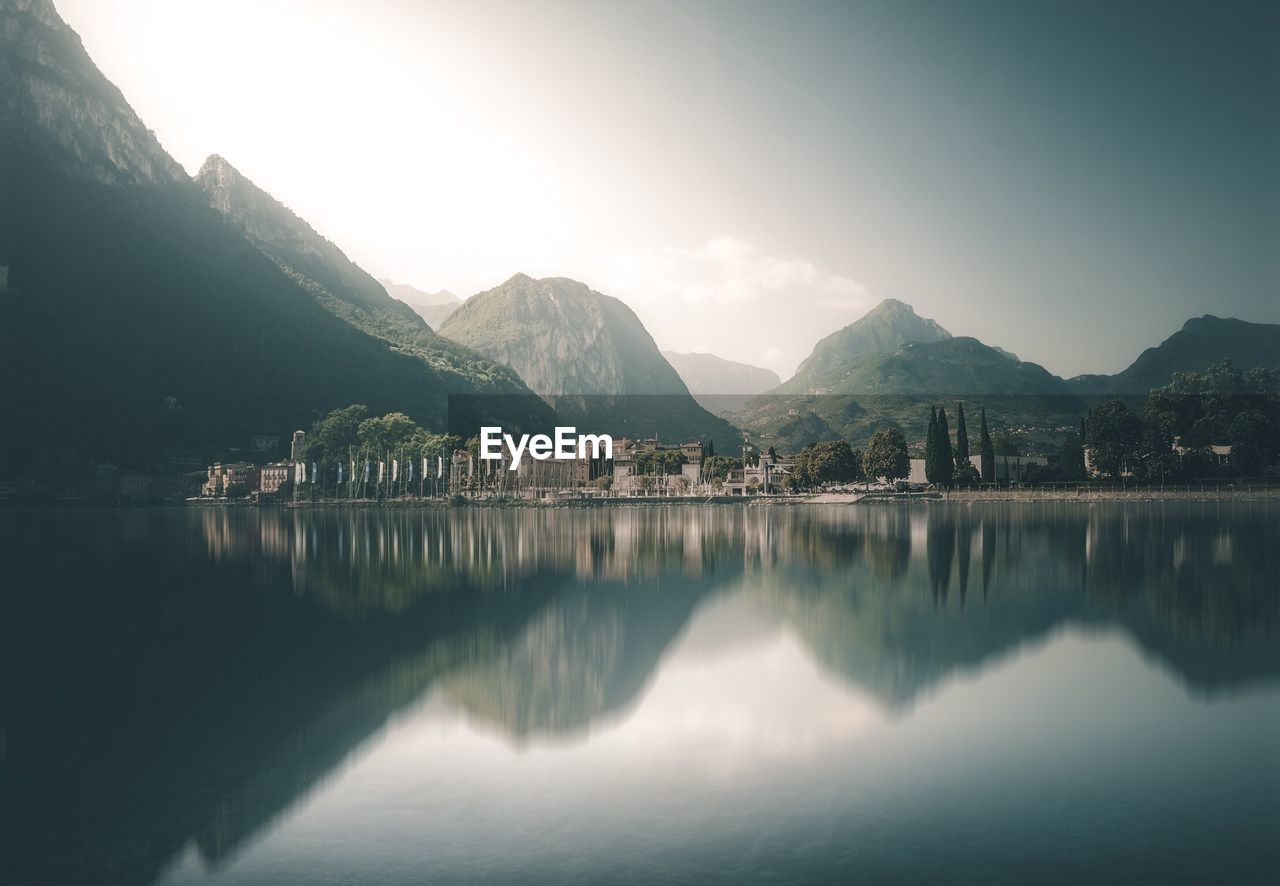 Scenic view of lake and mountains against sky