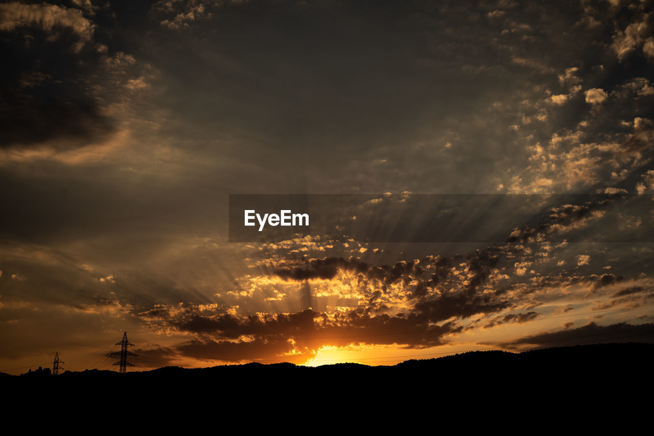 SCENIC VIEW OF DRAMATIC SKY DURING SUNSET