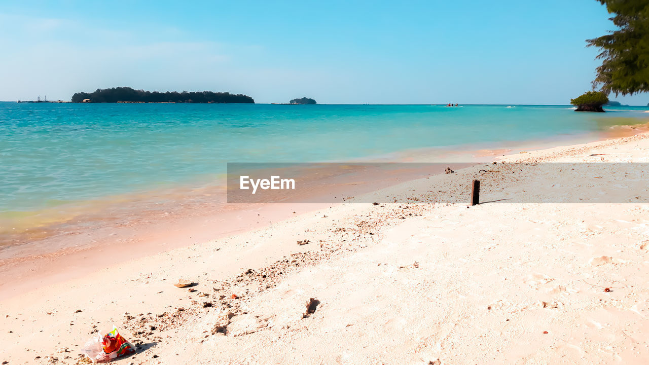 PANORAMIC VIEW OF BEACH AGAINST SKY