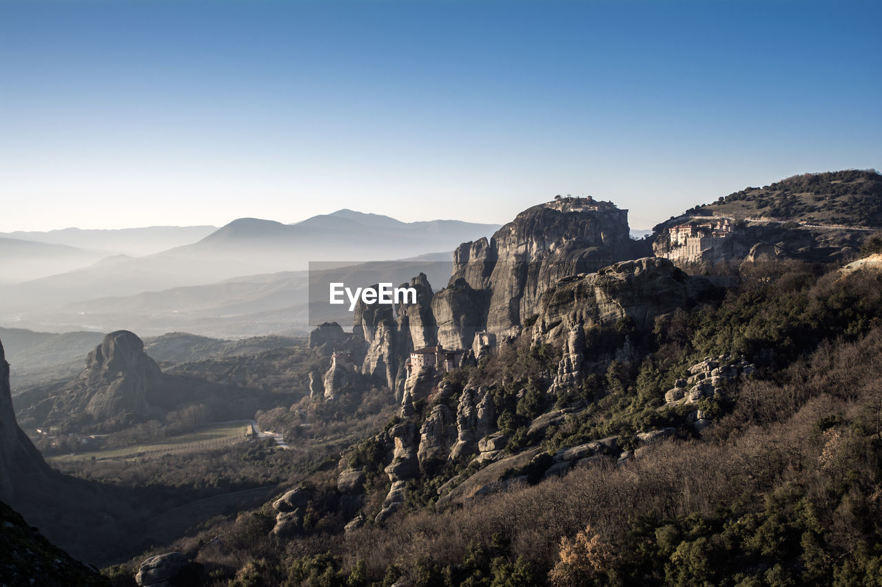 Panoramic view of landscape and mountains against clear sky