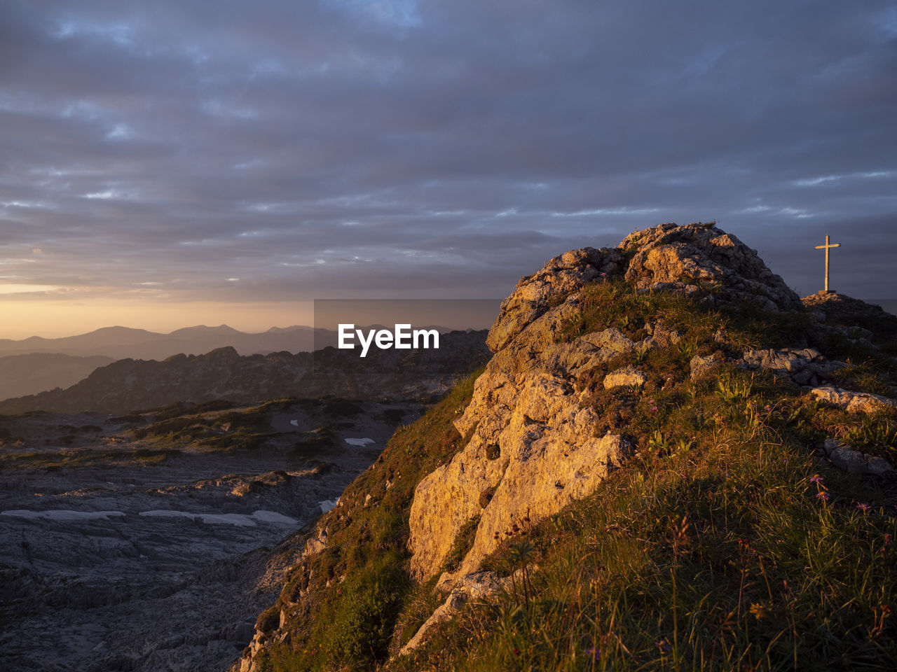 View of rock formation against cloud sky