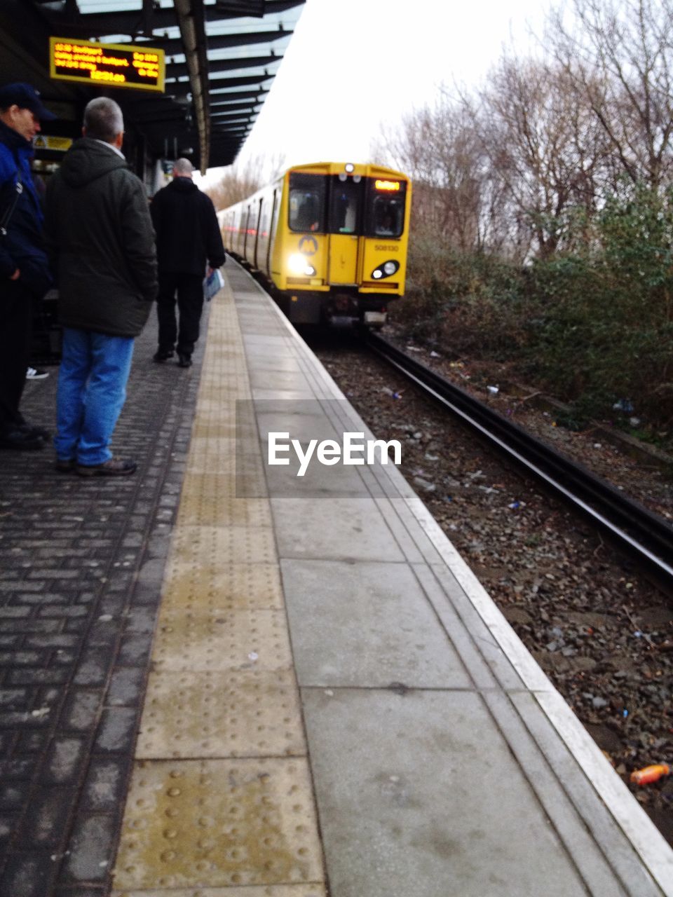 TRAIN ON RAILWAY STATION PLATFORM