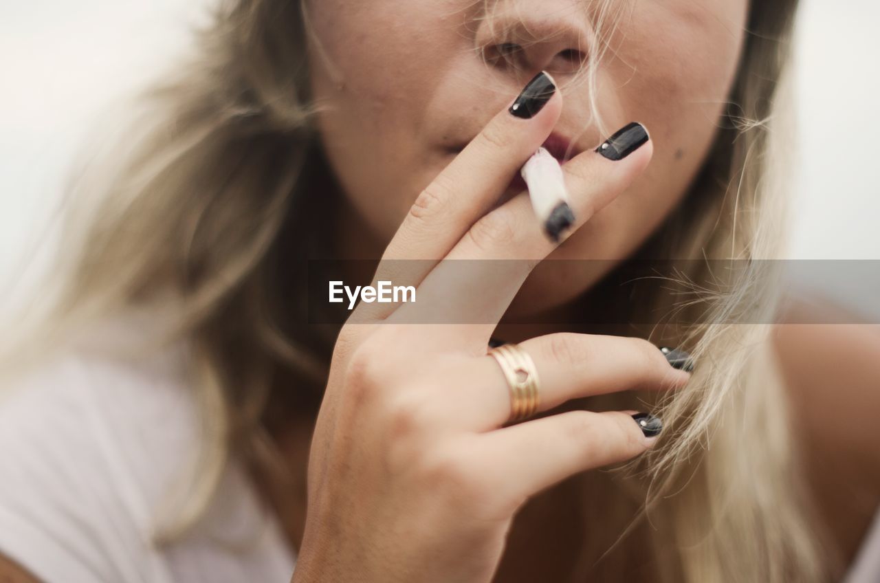 Close-up of woman smoking cigarette