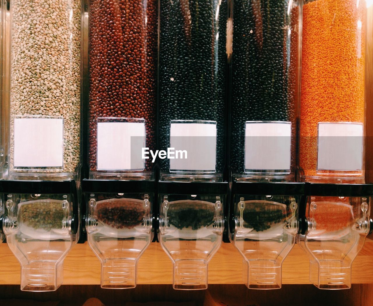 Various lentils in containers at store