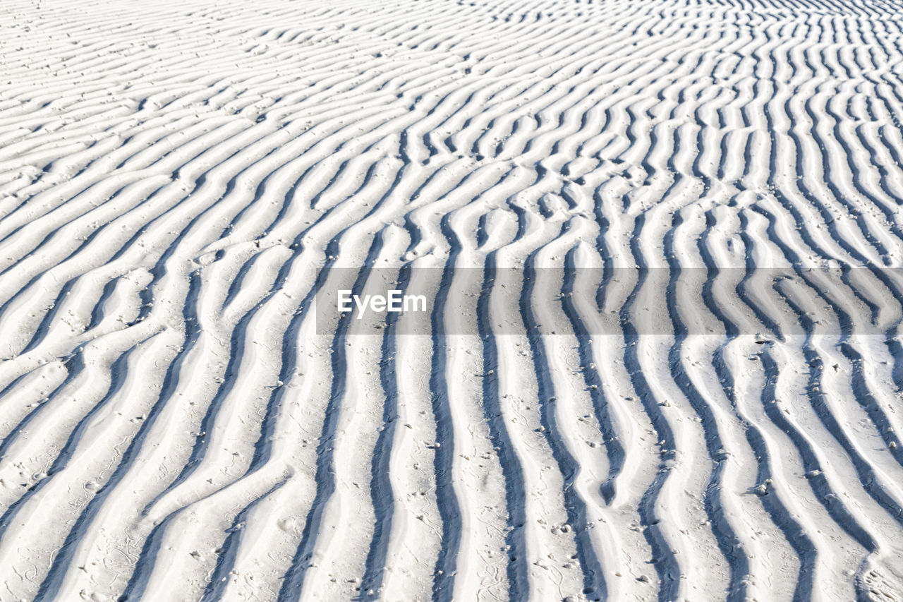 HIGH ANGLE VIEW OF SNOW ON LAND