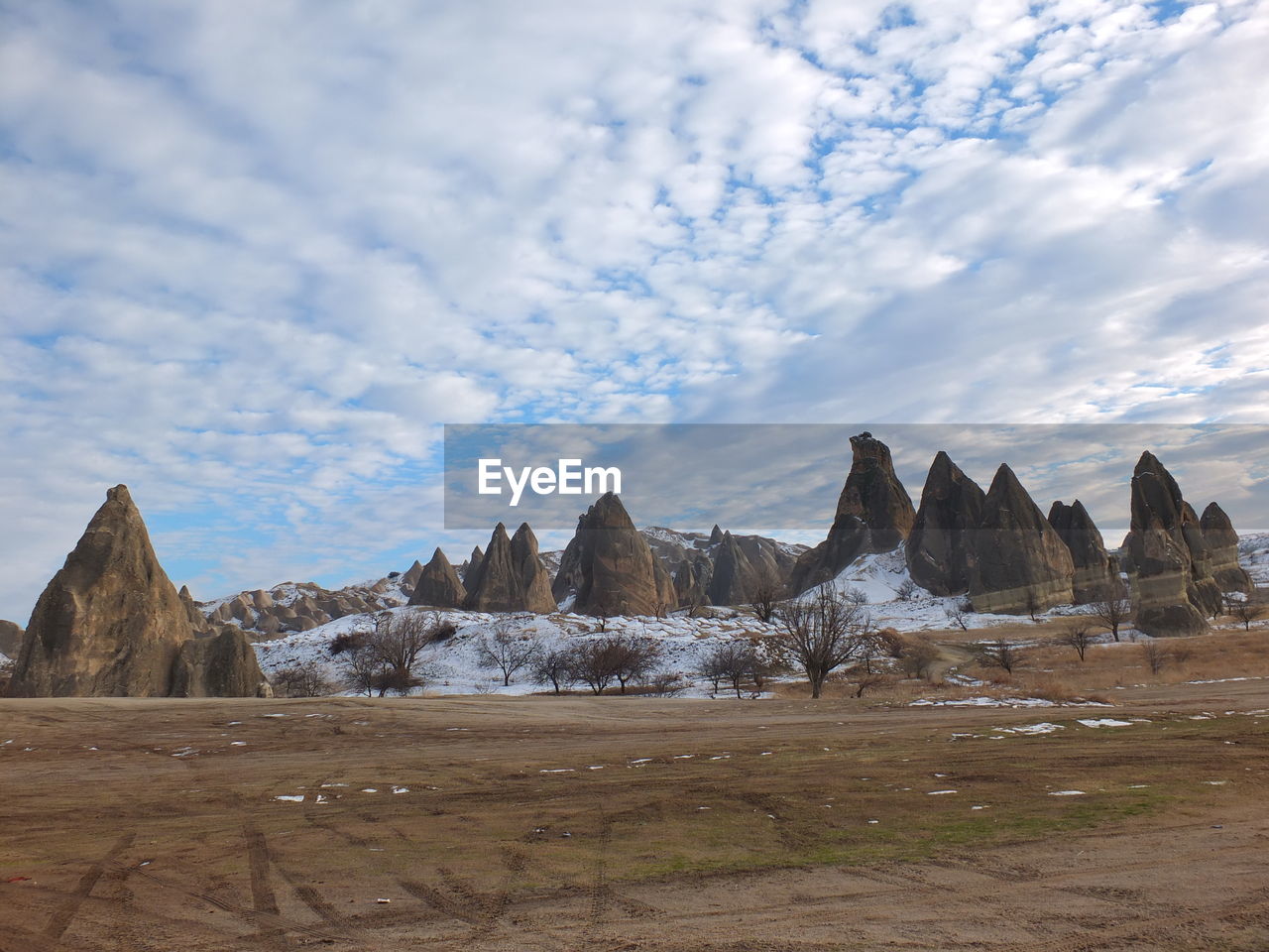 SCENIC VIEW OF ROCKS AGAINST SKY