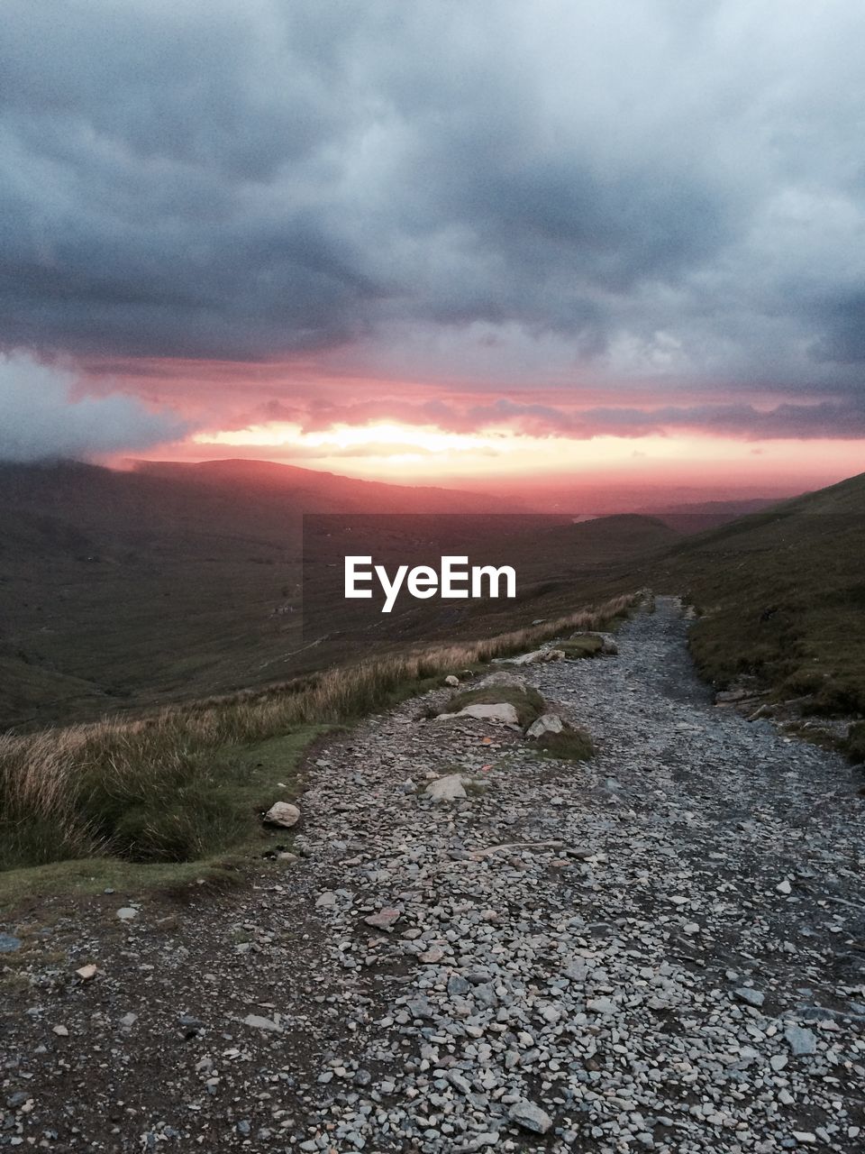 SURFACE LEVEL OF LAND AGAINST SKY DURING SUNSET