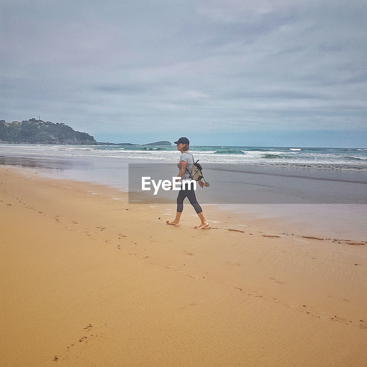 FULL LENGTH OF PERSON ON BEACH AGAINST SKY