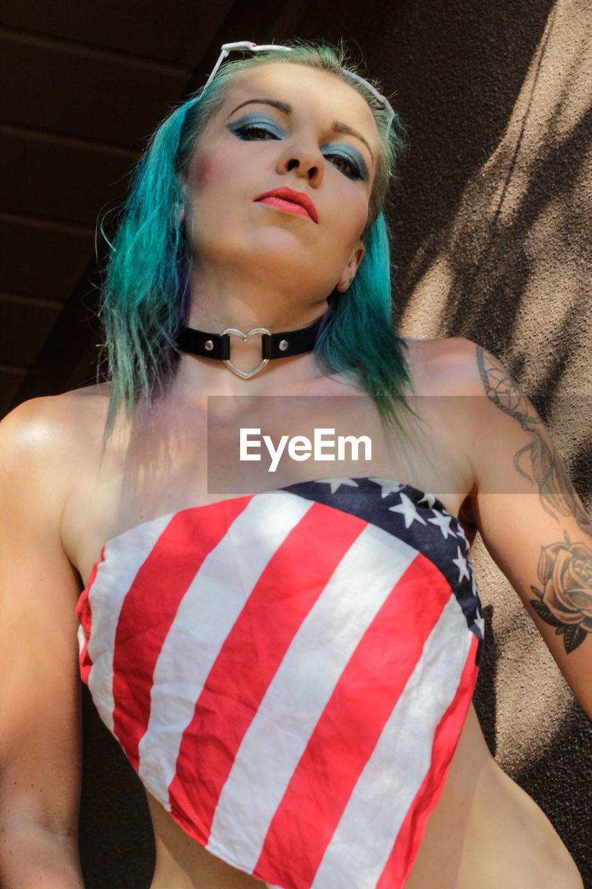 Portrait of sensuous woman wearing american flag tube top