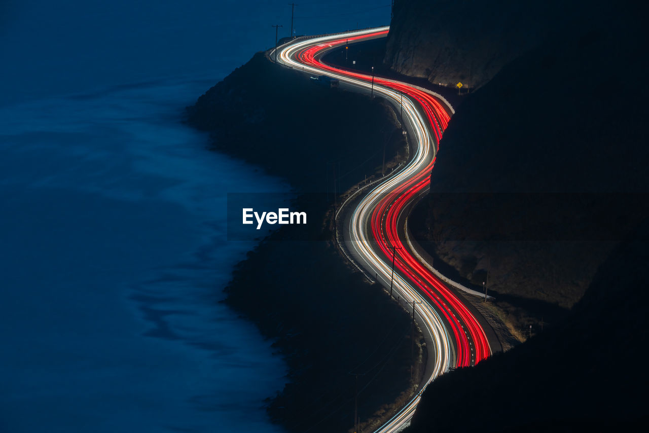 High angle view of light trails on road at night