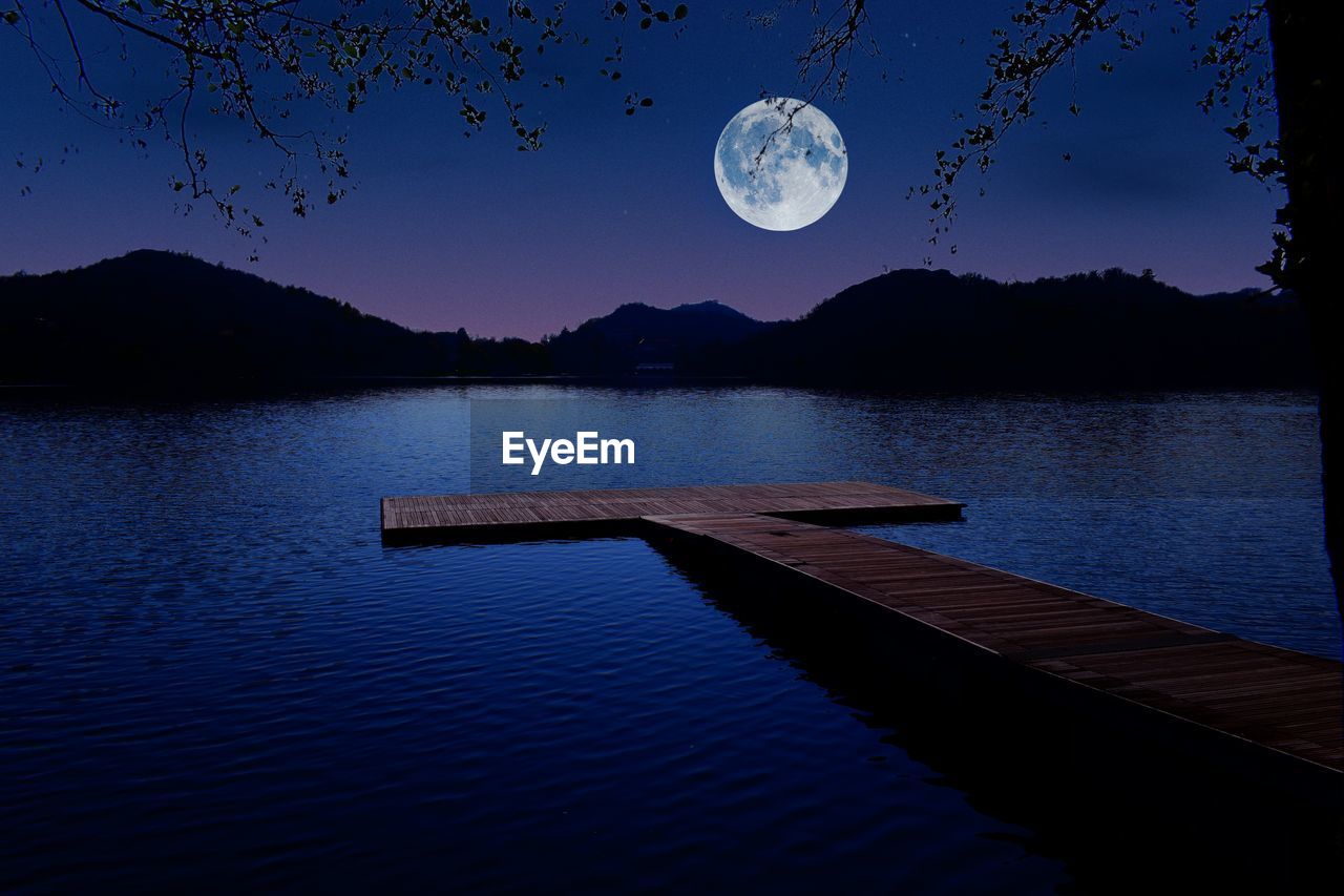 moon, moonlight, water, full moon, reflection, sky, tranquility, scenics - nature, beauty in nature, tranquil scene, nature, mountain, night, astronomical object, horizon, lake, no people, dusk, astronomy, space, outdoors, blue, mountain range, tree, evening, silhouette, idyllic, cloud, land, landscape, star, environment